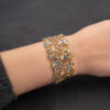 7586 Wide openwork yellow gold bracelet set with sapphires, tourmalines and pavé diamonds in a flexible lattice design