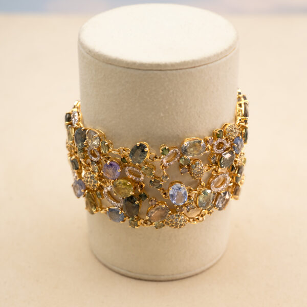 7619 Wide openwork yellow gold bracelet set with sapphires, tourmalines and pavé diamonds in a flexible lattice design