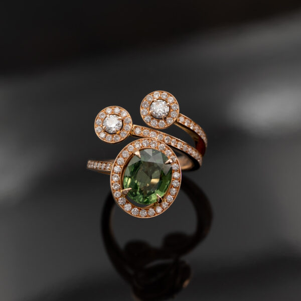 RoseGold_Diamond_Sapphire_ring 18K rose gold openwork ring with oval green sapphire and diamond halo, sculptural asymmetrical wrap design