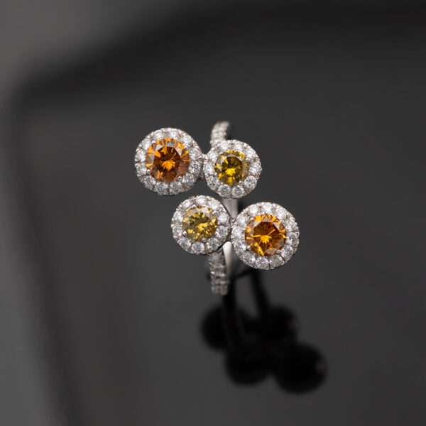 Fancy Colour Diamond Cluster Ring 18K white gold ring with four circular clusters of fancy colour diamonds surrounded by pavé-set white diamonds