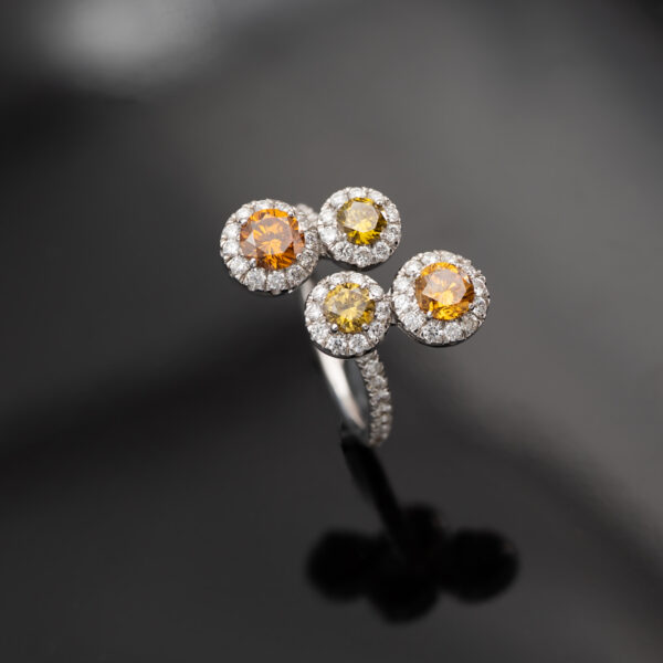 Fancy Colour Diamond Cluster Ring 18K white gold ring with four circular clusters of fancy colour diamonds surrounded by pavé-set white diamonds