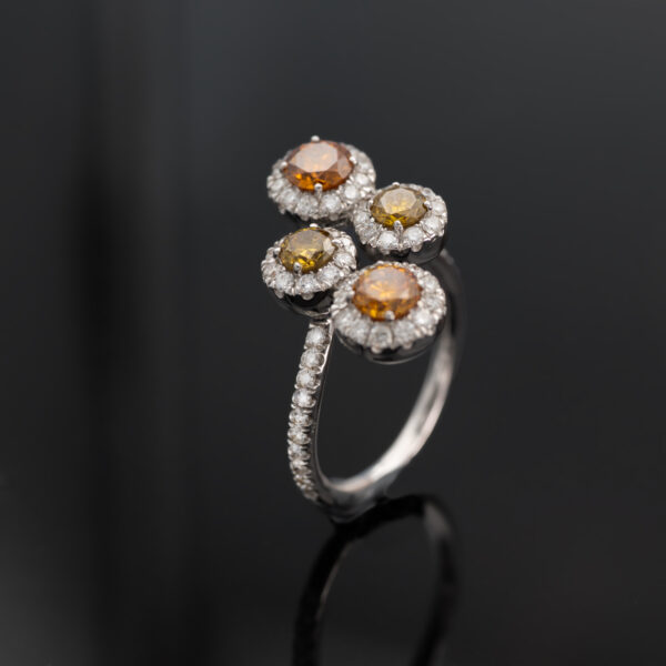 Fancy Colour Diamond Cluster Ring 18K white gold ring with four circular clusters of fancy colour diamonds surrounded by pavé-set white diamonds