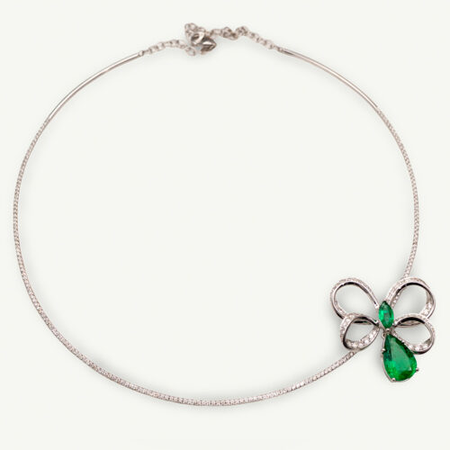 ClarisA_Cover_Bow_Emerald_Necklace White gold bow necklace with pavé diamonds and emerald drop