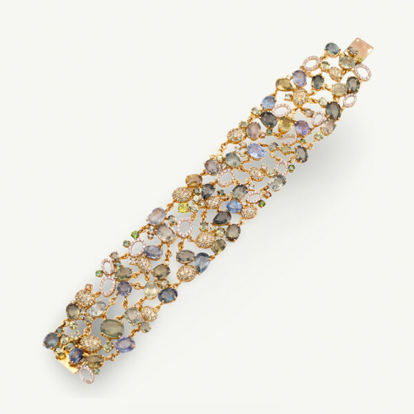 Cover_ClarisA_Bracelet Wide openwork yellow gold bracelet set with sapphires, tourmalines and pavé diamonds in a flexible lattice design
