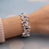 Sapphire Diamond Bracelet White Gold White gold bracelet with oval blue sapphires and diamond-set articulated links in a sculptural design