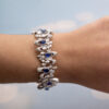 Sapphire Diamond Bracelet White Gold White gold bracelet with oval blue sapphires and diamond-set articulated links in a sculptural design