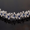 Sapphire Diamond Bracelet White Gold White gold bracelet with oval blue sapphires and diamond-set articulated links in a sculptural design