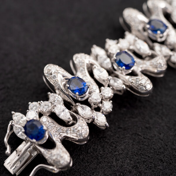 Sapphire Diamond Bracelet White Gold White gold bracelet with oval blue sapphires and diamond-set articulated links in a sculptural design
