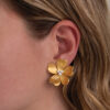 Italian Diamond Flower Earrings in 18K Yellow Gold Italian five-petal diamond flower earrings in textured 18K yellow gold with round brilliant-cut diamond centers by Claris-A.
