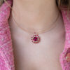 Floral Rubellite, Ruby & Diamond Cluster Pendant Necklace in Rose Gold Close-up of a 18K rose gold pendant necklace featuring a central rubellite surrounded by rubies and diamonds in a floral cluster design
