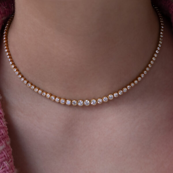 Milgrain Diamond Tennis Necklace Yellow Gold 18k yellow gold tennis necklace with graduated round diamonds in a milgrain setting.