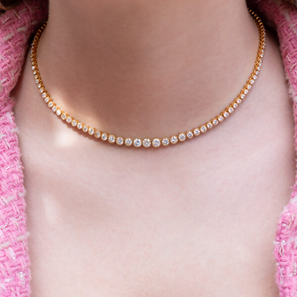 Milgrain Diamond Tennis Necklace Yellow Gold 18k yellow gold tennis necklace with graduated round diamonds in a milgrain setting.