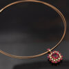 Floral Rubellite, Ruby & Diamond Cluster Pendant Necklace in Rose Gold Close-up of a 18K rose gold pendant necklace featuring a central rubellite surrounded by rubies and diamonds in a floral cluster design