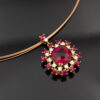 Floral Rubellite, Ruby & Diamond Cluster Pendant Necklace in Rose Gold Close-up of a 18K rose gold pendant necklace featuring a central rubellite surrounded by rubies and diamonds in a floral cluster design