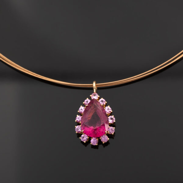 Pink Rubellite Drop Necklace Pear-shaped rubellite and pink sapphire pendant necklace in 18K rose gold with articulated chain.
