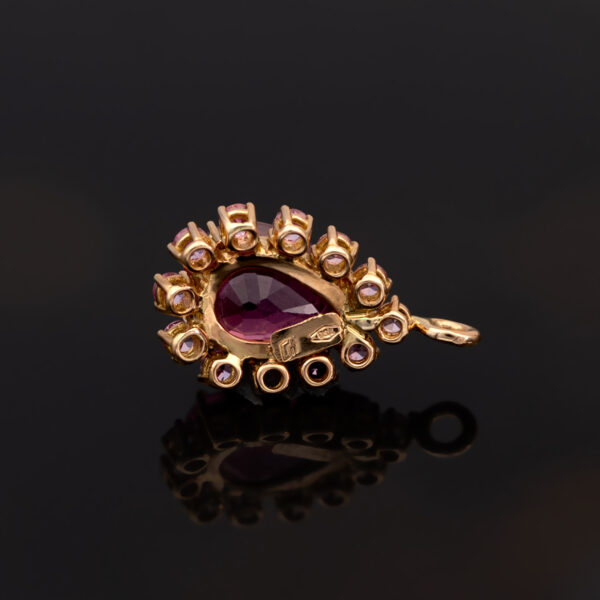 Pink Rubellite Drop Necklace Pear-shaped rubellite and pink sapphire pendant necklace in 18K rose gold with articulated chain.