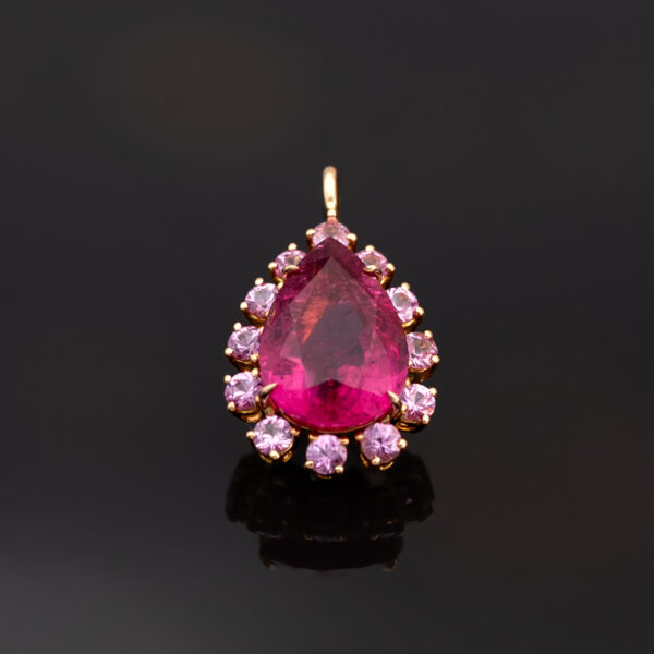 Pink Rubellite Drop Necklace Pear-shaped rubellite and pink sapphire pendant necklace in 18K rose gold with articulated chain.