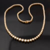 Milgrain Diamond Tennis Necklace Yellow Gold 18k yellow gold tennis necklace with graduated round diamonds in a milgrain setting.