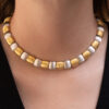 Italian Dual-Tone Gold Sculptural Necklace Italian 18K white and yellow gold sculptural necklace with textured engraved links and rounded connectors.
