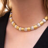 Italian Dual-Tone Gold Sculptural Necklace Italian 18K white and yellow gold sculptural necklace with textured engraved links and rounded connectors.
