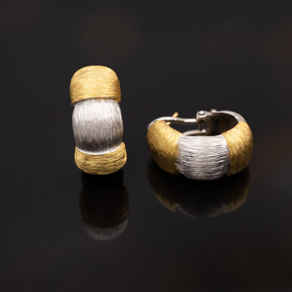 Italian Dual-Tone Gold Sculptural Earrings Italian 18K white and yellow gold sculptural earrings with handmade engraved textured links and rounded gold details.