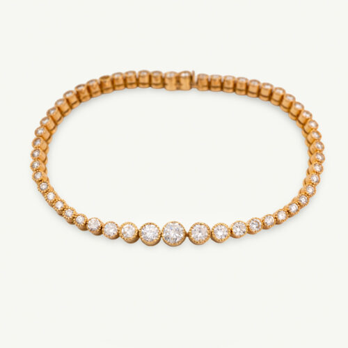 Milgrain Diamond Tennis Bracelet Yellow Gold 18k yellow gold tennis bracelet with graduated round diamonds in a milgrain setting.