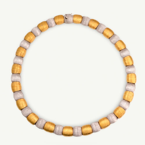 Italian Dual-Tone Gold Sculptural Necklace Italian 18K white and yellow gold sculptural necklace with textured engraved links and rounded connectors.