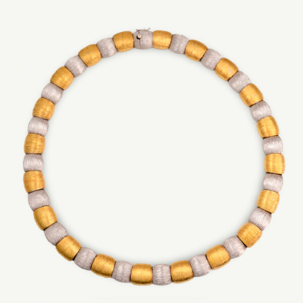 Italian Dual-Tone Gold Sculptural Necklace Italian 18K white and yellow gold sculptural necklace with textured engraved links and rounded connectors.