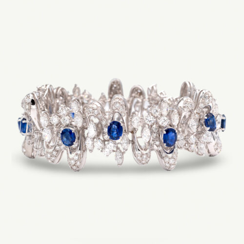 Sapphire Diamond Bracelet White Gold White gold bracelet with oval blue sapphires and diamond-set articulated links in a sculptural design