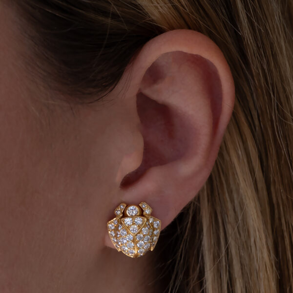 Diamond Scarab Earrings in 18K Yellow Gold Sculptural 18K yellow gold scarab earrings set with diamonds, featuring a domed beetle design with geometric detailing and high-jewelry finish.