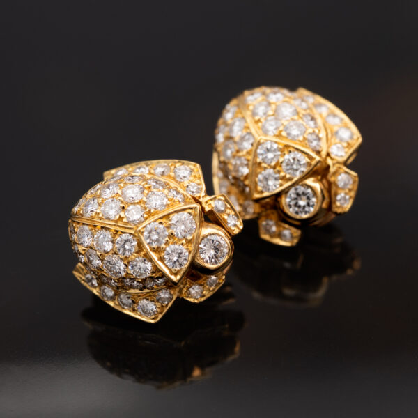 Diamond Scarab Earrings in 18K Yellow Gold Sculptural 18K yellow gold scarab earrings set with diamonds, featuring a domed beetle design with geometric detailing and high-jewelry finish.