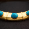 Persian Blue Turquoise Collar Necklace in 18K Yellow Gold Hand-hammered 18K yellow gold collar necklace set with natural Persian-blue turquoise cabochons and concealed closure.