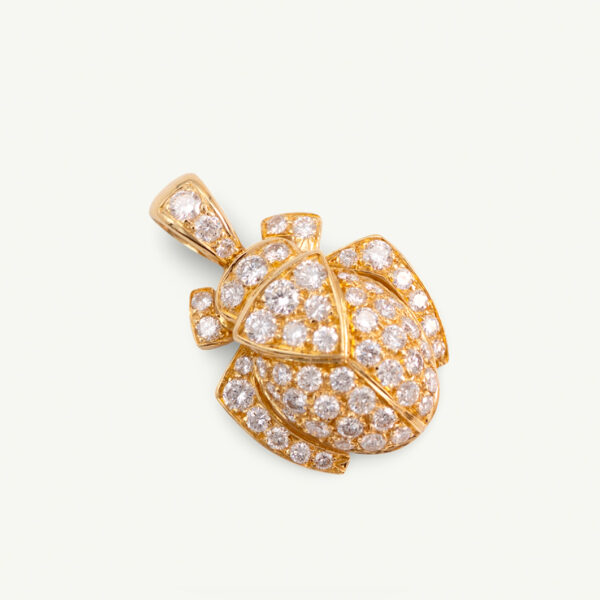 Diamond Scarab Pendant in 18K Yellow Gold Sculptural 18K yellow gold scarab pendant set with diamonds, featuring a domed beetle design with geometric detailing and high-jewelry finish.