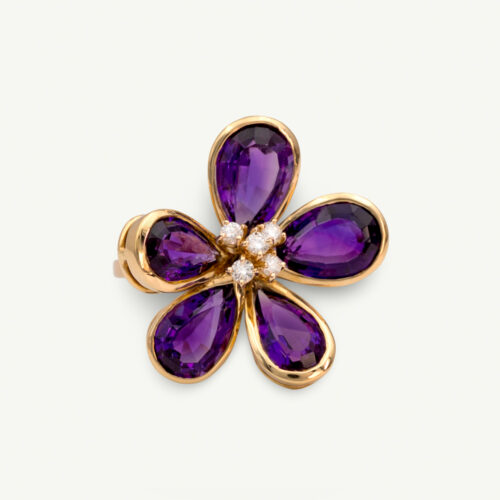 Amethyst Flower Ring in 18K Yellow Gold 18K yellow gold flower ring set with five pear-cut amethysts surrounding a diamond-set centre.