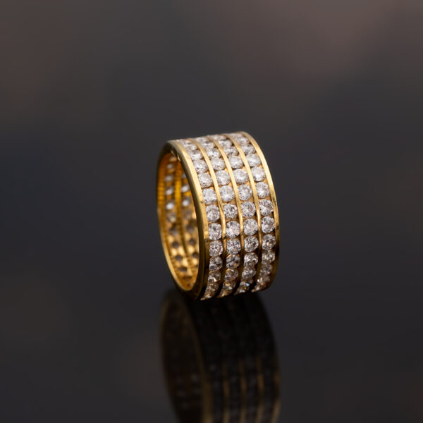 Four-Row Diamond Alliance Ring in 18K Yellow Gold 18K yellow gold four-row diamond alliance ring with round diamonds in a wide polished band.