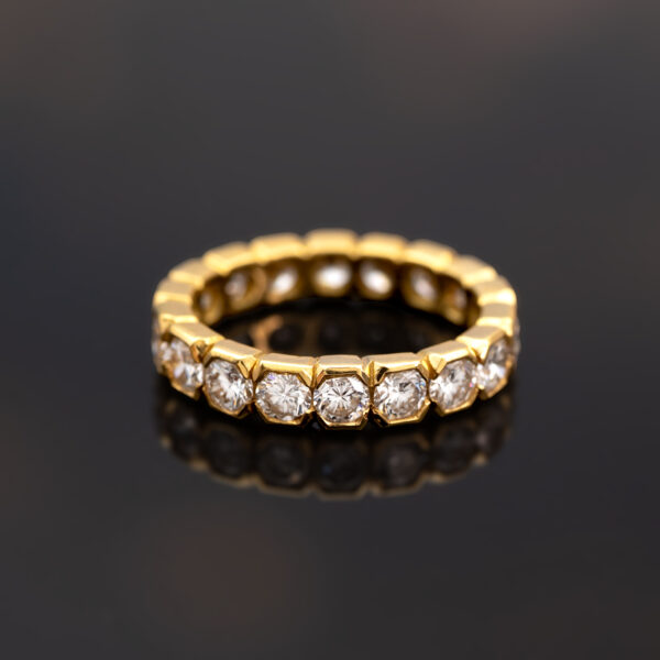 Hexagon Diamond Eternity Ring in 18K Yellow Gold 18K yellow gold eternity ring with round brilliant-cut diamonds in hexagonal gold settings.