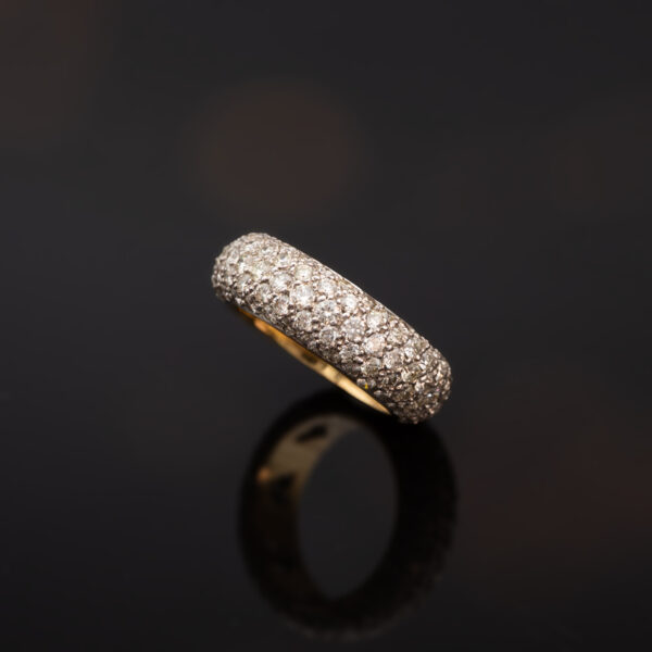 9406 18K white and yellow gold diamond bombe ring set with diamonds and featuring a rounded dual-tone design.