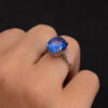 Natural Unheated Ceylon Sapphire Cabochon Ring in 18K White Gold Natural unheated Sri Lankan Ceylon blue sapphire cabochon ring in 18K white gold with diamond-set shoulders.