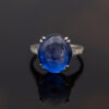 Natural Unheated Ceylon Sapphire Cabochon Ring in 18K White Gold Natural unheated Sri Lankan Ceylon blue sapphire cabochon ring in 18K white gold with diamond-set shoulders.