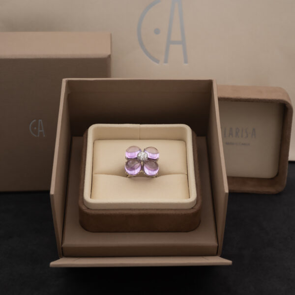 Amethyst Flower Ring in 18K White Gold 18K white gold flower ring with four amethyst cabochons and a diamond centre.