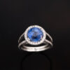 Natural Unheated Ceylon Cornflower Blue Sapphire Halo Ring in 18K White Gold Certified natural unheated cornflower blue Ceylon sapphire halo ring with diamonds in 18K white gold.