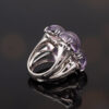 Amethyst Flower Ring in 18K White Gold 18K white gold flower ring with four amethyst cabochons and a diamond centre.