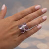 Amethyst Flower Ring in 18K White Gold 18K white gold flower ring with four amethyst cabochons and a diamond centre.