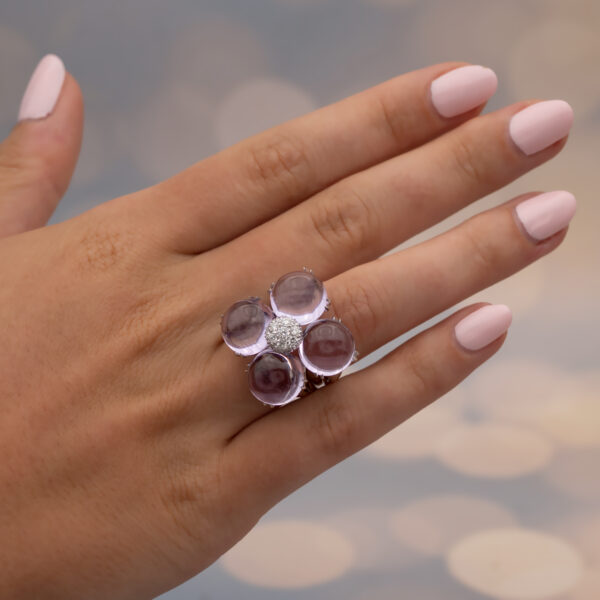 Amethyst Flower Ring in 18K White Gold 18K white gold flower ring with four amethyst cabochons and a diamond centre.