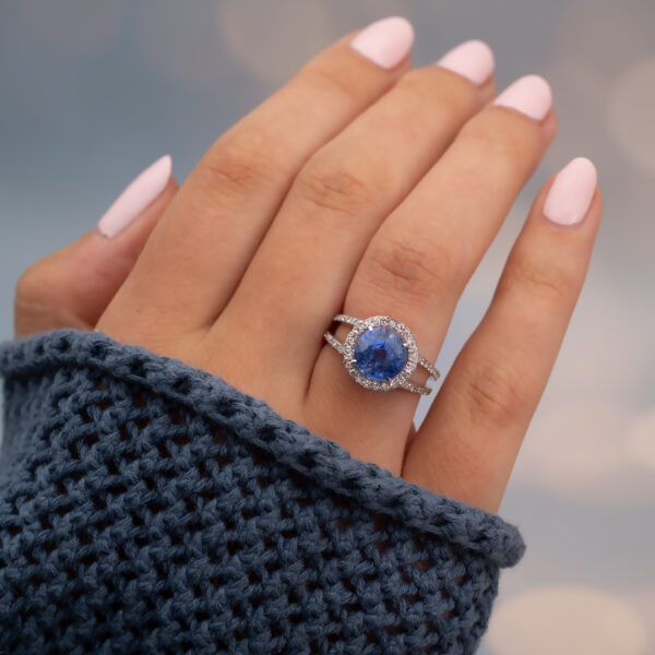 Natural Unheated Ceylon Cornflower Blue Sapphire Halo Ring in 18K White Gold Certified natural unheated cornflower blue Ceylon sapphire halo ring with diamonds in 18K white gold.