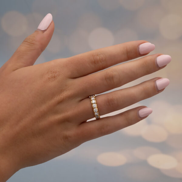 Hexagon Diamond Eternity Ring in 18K Yellow Gold 18K yellow gold eternity ring with round brilliant-cut diamonds in hexagonal gold settings.