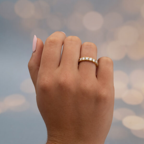 Hexagon Diamond Eternity Ring in 18K Yellow Gold 18K yellow gold eternity ring with round brilliant-cut diamonds in hexagonal gold settings.
