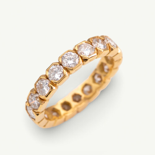 Hexagon Diamond Eternity Ring in 18K Yellow Gold 18K yellow gold eternity ring with round brilliant-cut diamonds in hexagonal gold settings.