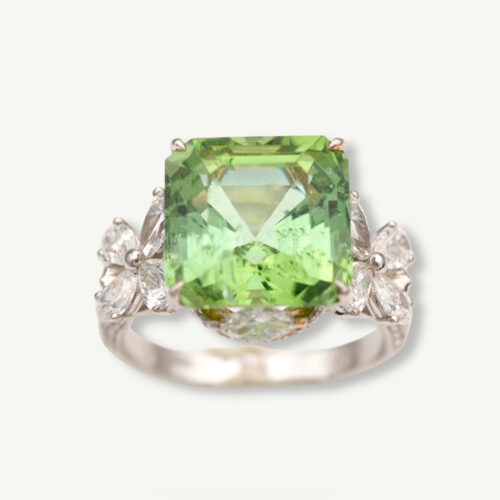 Green Tourmaline Blossom Ring in 18K White Gold 18K white gold ring with a cushion-shaped green tourmaline surrounded by pear-shaped and brilliant-cut diamonds in a floral-inspired setting.
